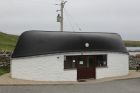 The shower block at Burravoe camp site. Yes, that is a life boat.